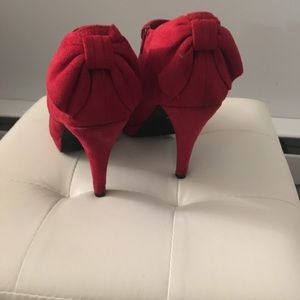 Red high heels with bows